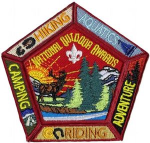 National Outdoor Badges. The location/order of the segments around the central patch does not matter. The emblem was originally designed to be worn centered on the right pocket of the jac-shirt, or the field uniform shirt but also may be worn on the backside of the merit badge sash.